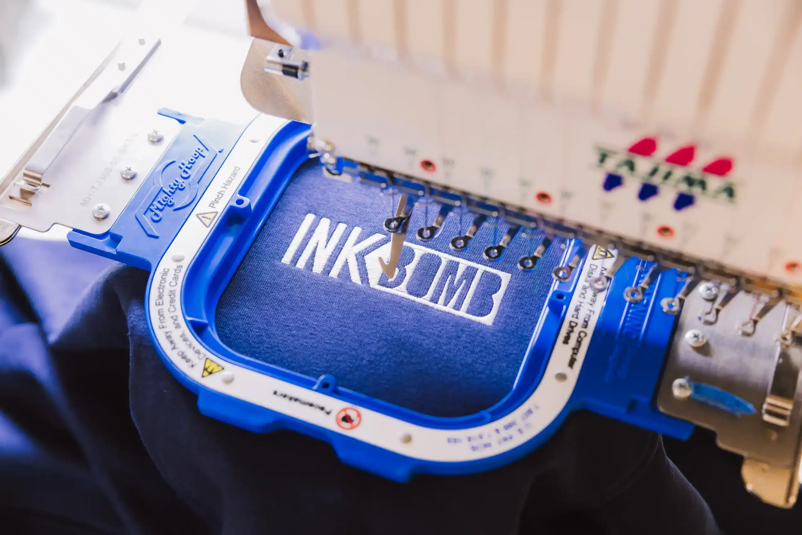 Embroidery Services Premium Tajima single head embroidery machine at Ink Bomb